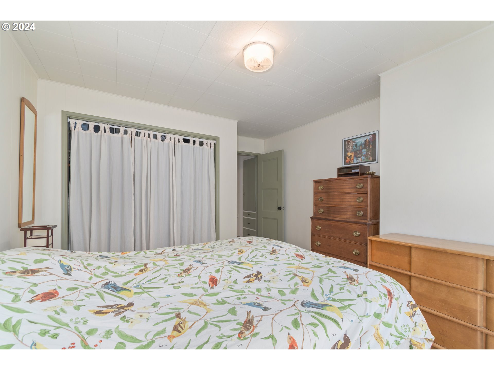 369 West D Street Springfield, OR 97477 - Photo 23 of 48 a bedroom with a bed and cabinet