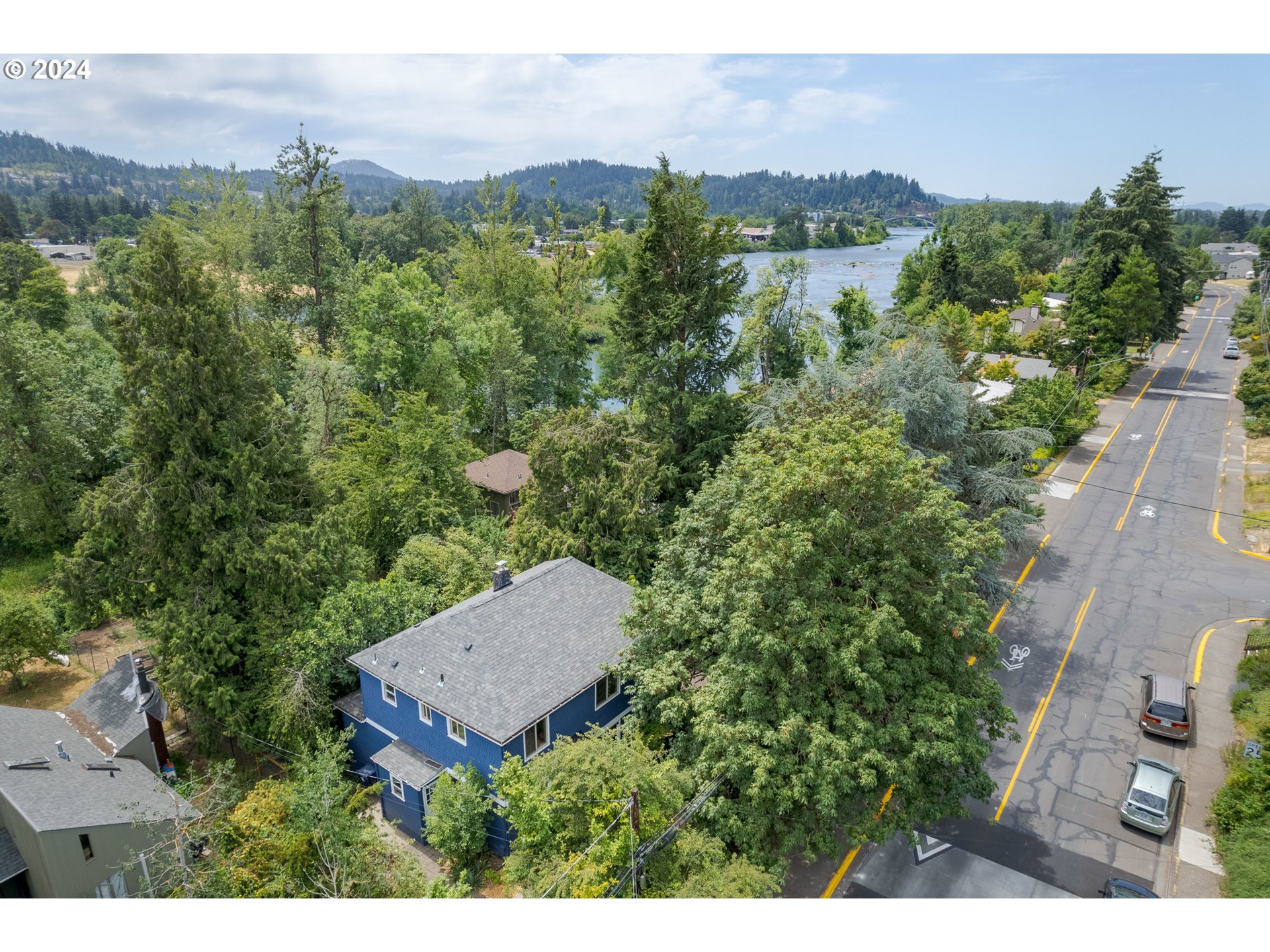 369 West D Street Springfield, OR 97477 - Photo 3 of 48 an aerial view of a house with mountain view