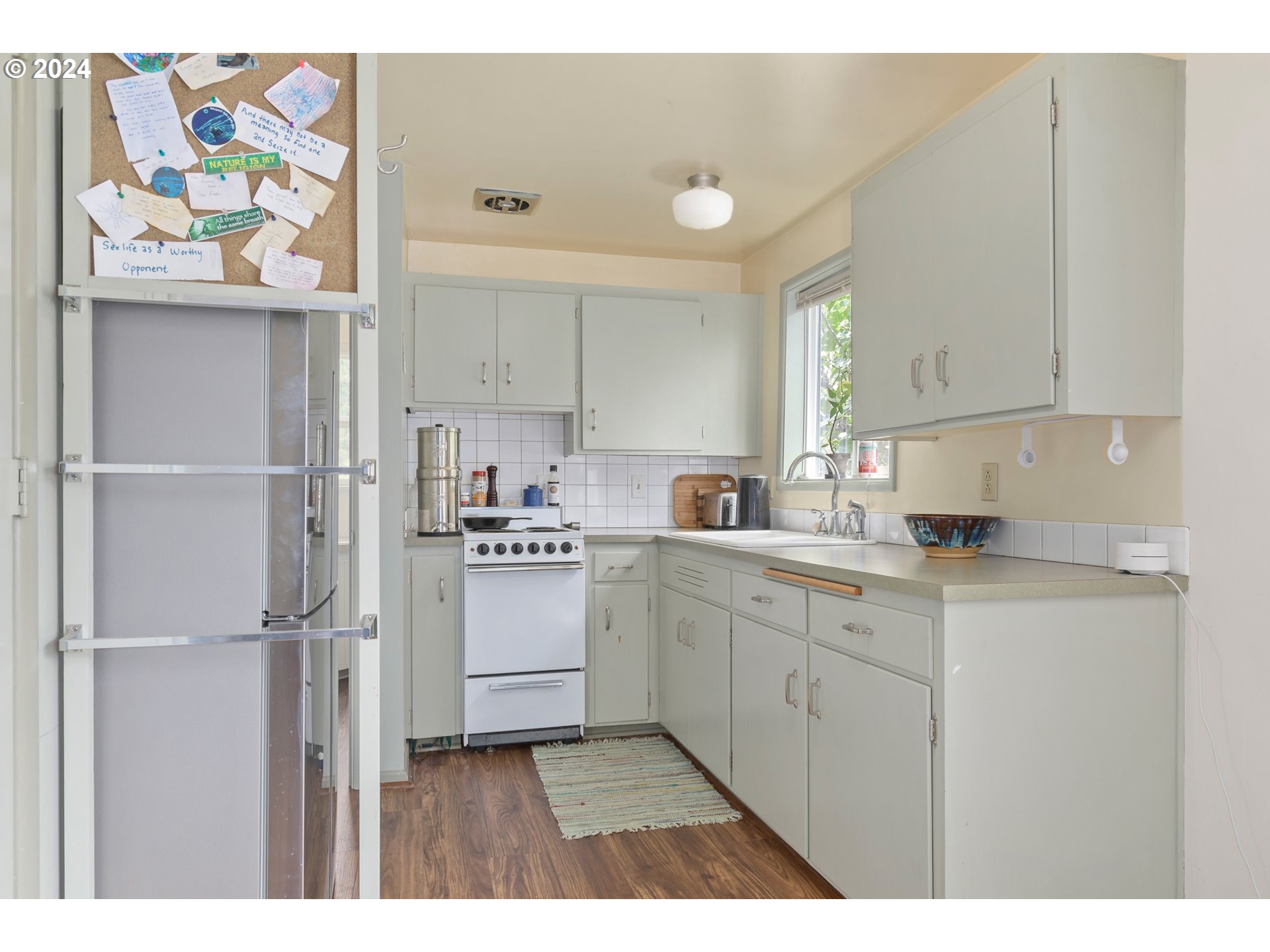 369 West D Street Springfield, OR 97477 - Photo 31 of 48 a kitchen with cabinets and window