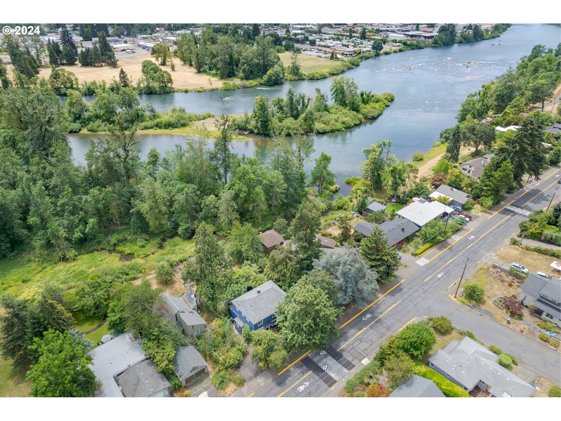 369 West D Street Springfield, OR 97477 - Photo 4 of 48 an aerial view of lake residential house with outdoor space and trees around