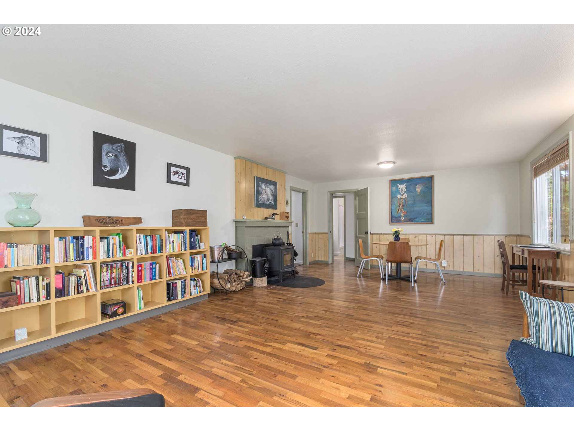 369 West D Street Springfield, OR 97477 - Photo 10 of 48 a living room with lots of furniture and a book shelf