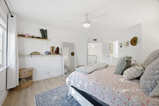 a bedroom with a bed and cabinets