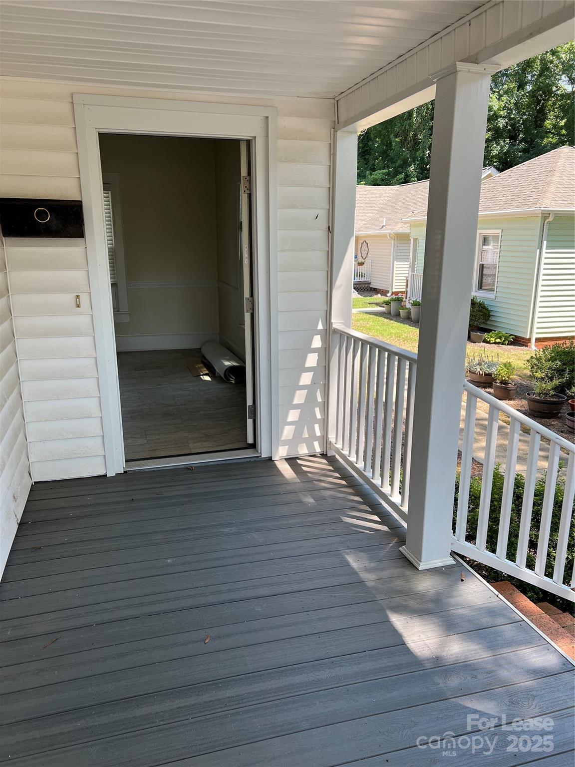 201 Goldston Street Kannapolis, NC 28081 - Photo 7 of 12 a view of an entryway door with a glass door