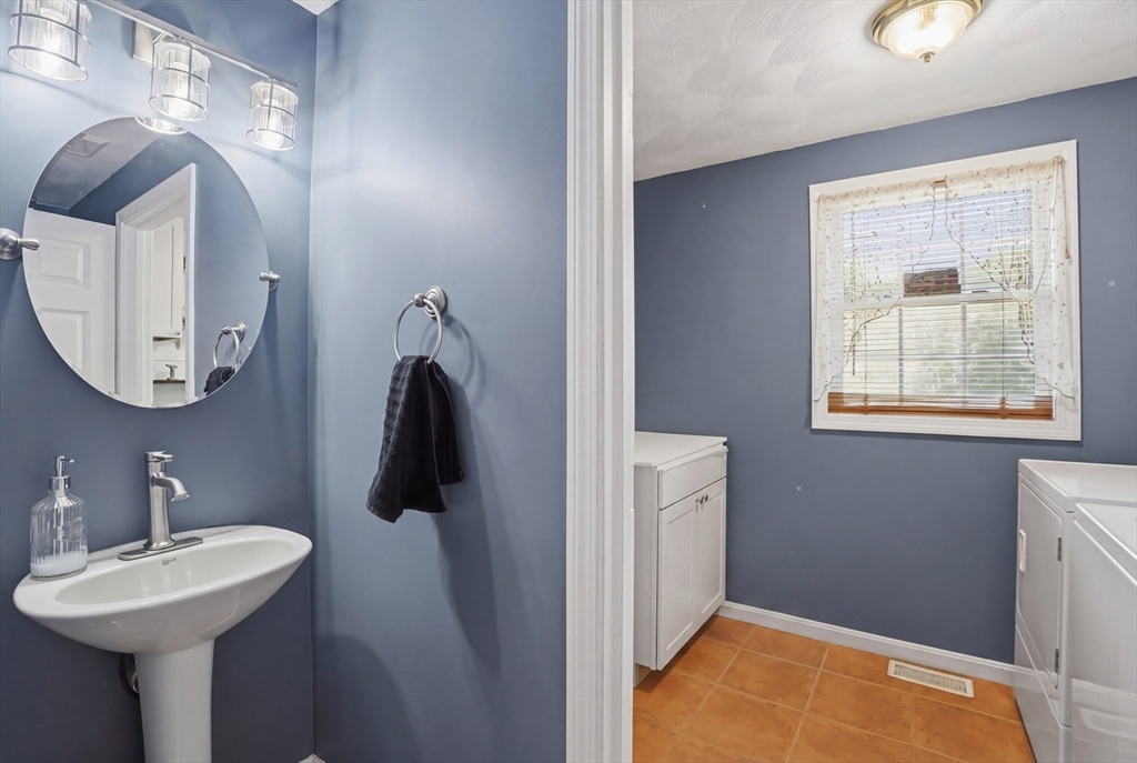 160 Gray Road Templeton, MA 01468 - Photo 33 of 42 a bathroom with a sink and mirror with window