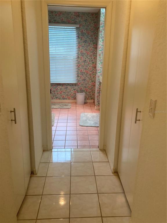 8744 Southwest 108th Ln Road Ocala, FL 34481 - Photo 5 of 28 a bathroom with a glass door shower