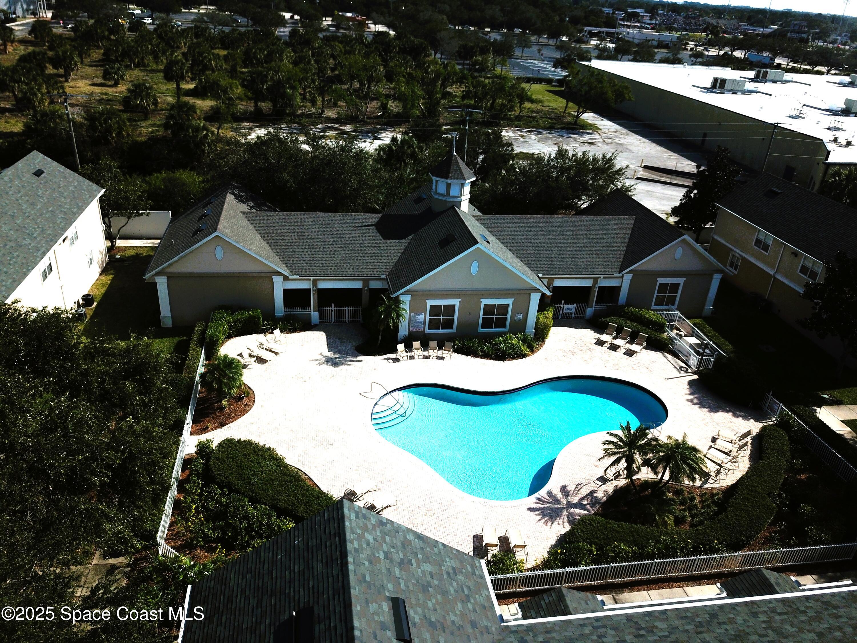 110 Turpial Way, Unit 103 Melbourne, FL 32901 - Photo 2 of 20 an aerial view of house with yard
