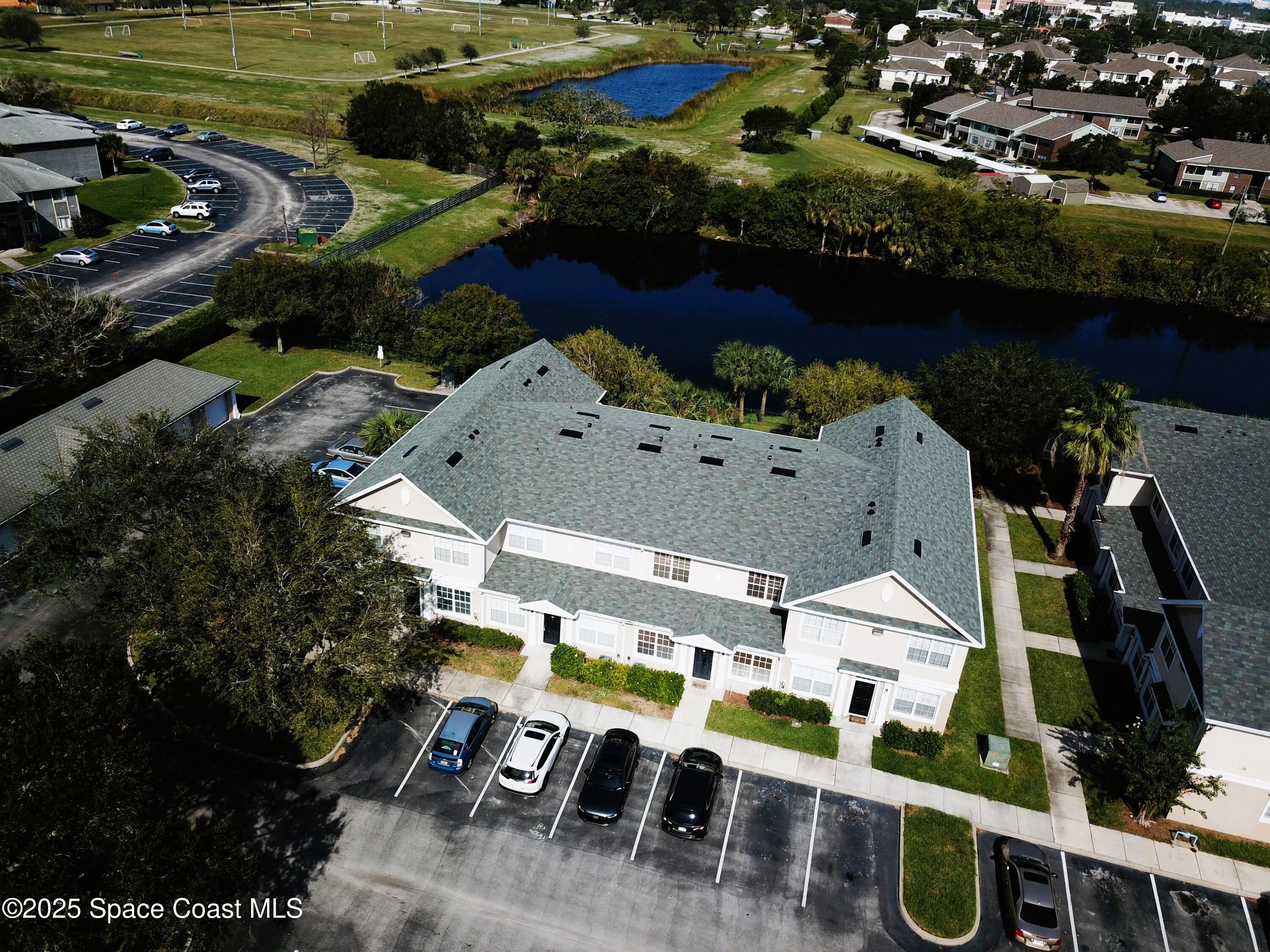 110 Turpial Way, Unit 103 Melbourne, FL 32901 - Photo 3 of 20 an aerial view of residential houses with outdoor space