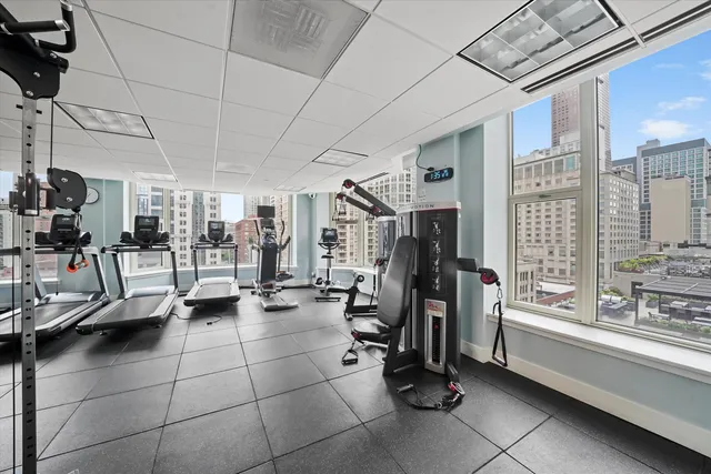 a view of gym equipment and windows