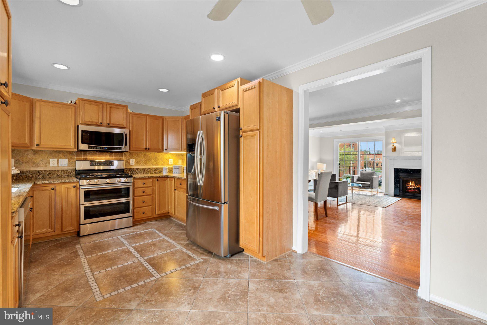 6 West Glebe Road Alexandria, VA 22305 - Photo 13 of 45 a kitchen with stainless steel appliances a refrigerator and a stove top oven