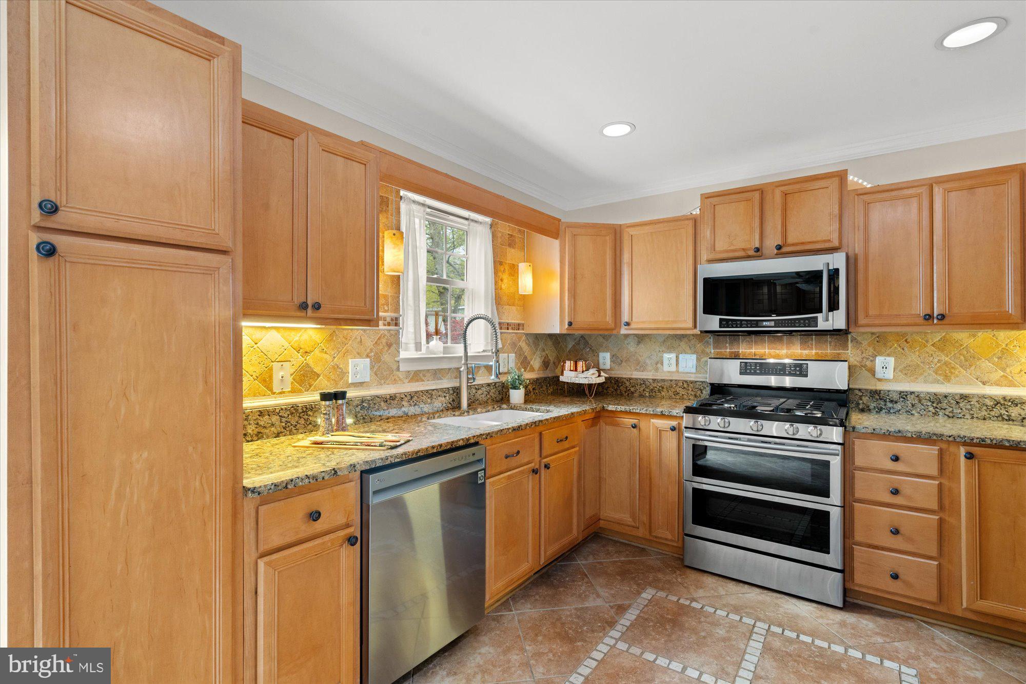 6 West Glebe Road Alexandria, VA 22305 - Photo 15 of 45 a kitchen with stainless steel appliances granite countertop a stove a sink and a microwave