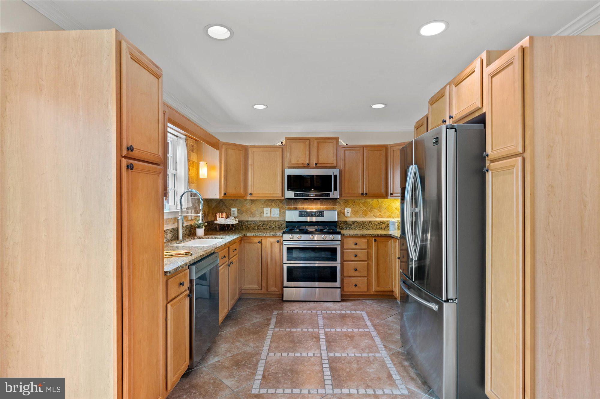 6 West Glebe Road Alexandria, VA 22305 - Photo 16 of 45 a kitchen with stainless steel appliances granite countertop a refrigerator stove and oven