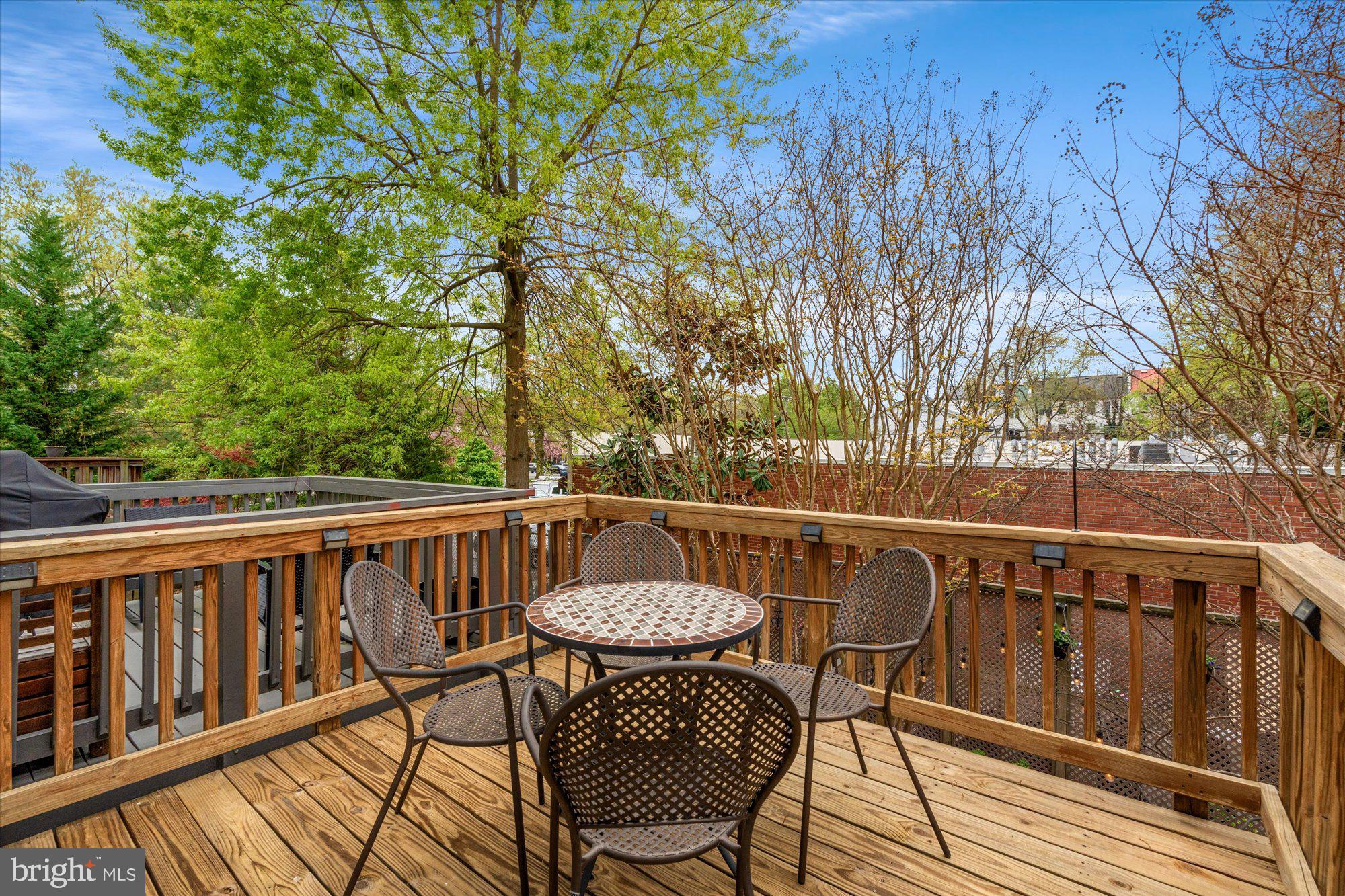 6 West Glebe Road Alexandria, VA 22305 - Photo 19 of 45 a view of a chairs and table on the deck