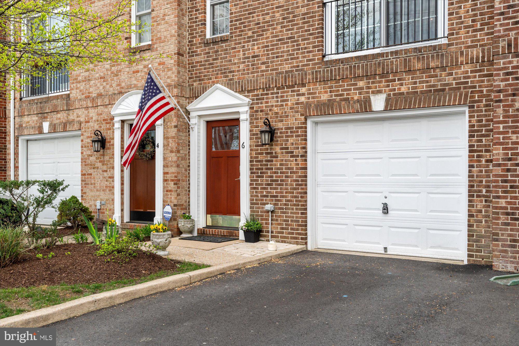 6 West Glebe Road Alexandria, VA 22305 - Photo 2 of 45 a front view of a house with a yard and garage