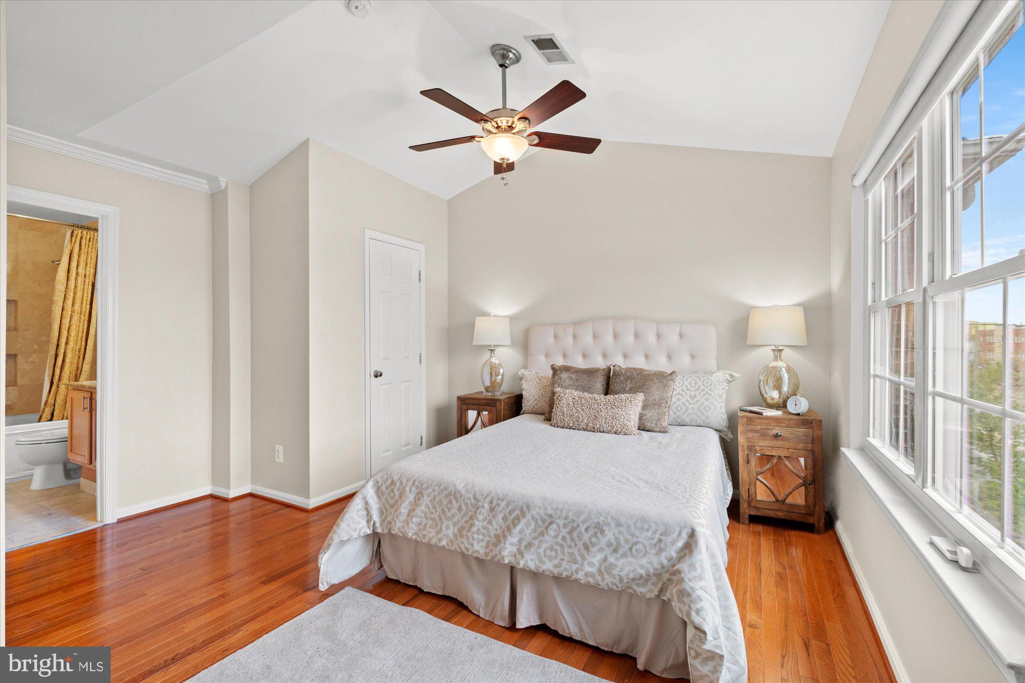 6 West Glebe Road Alexandria, VA 22305 - Photo 21 of 45 a bedroom with a large bed and a chandelier