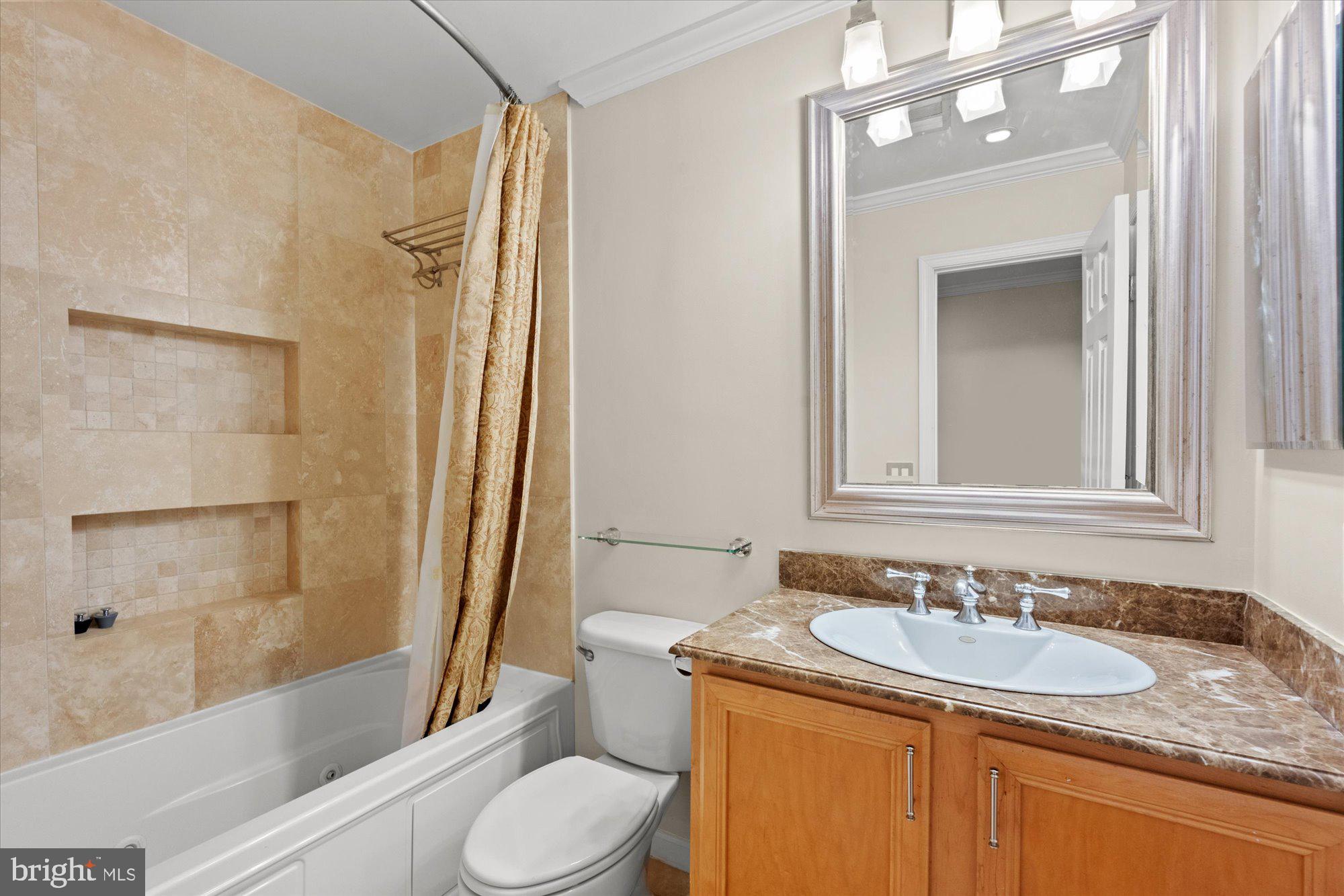6 West Glebe Road Alexandria, VA 22305 - Photo 25 of 45 a bathroom with a granite countertop sink toilet and shower