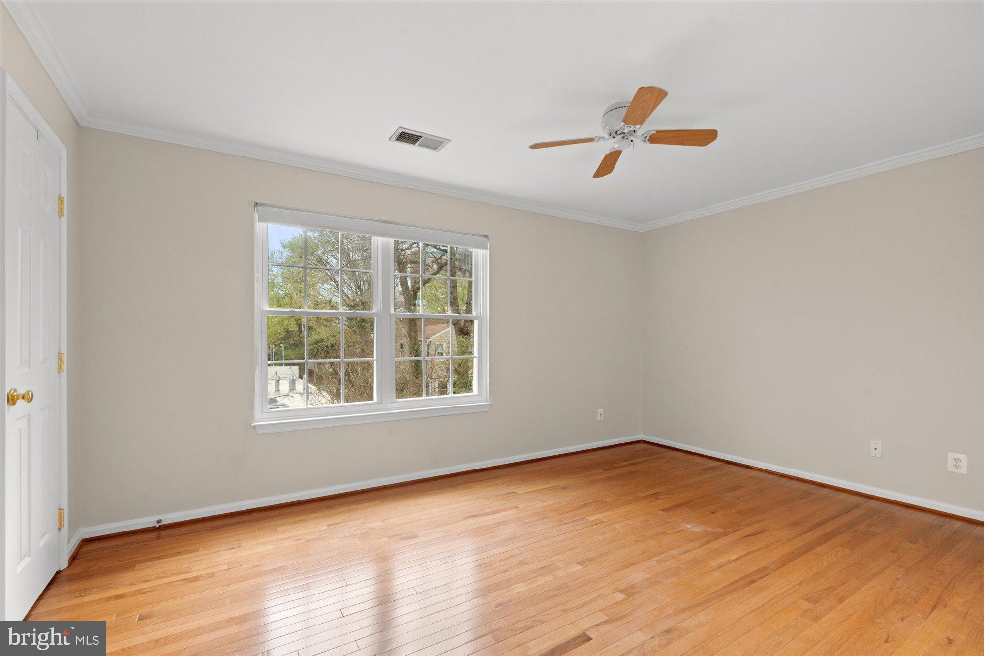 6 West Glebe Road Alexandria, VA 22305 - Photo 29 of 45 an empty room with wooden floor and windows