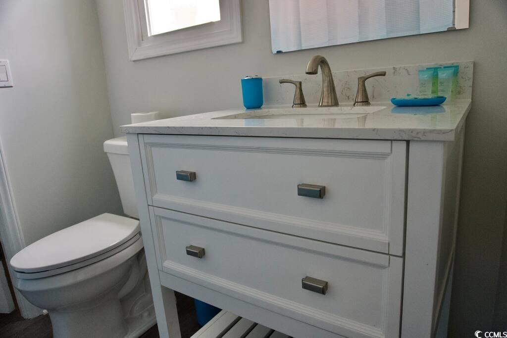 4702 South Ocean Boulevard Surfside Beach, SC 29575 - Photo 18 of 39 Bathroom with vanity and toilet