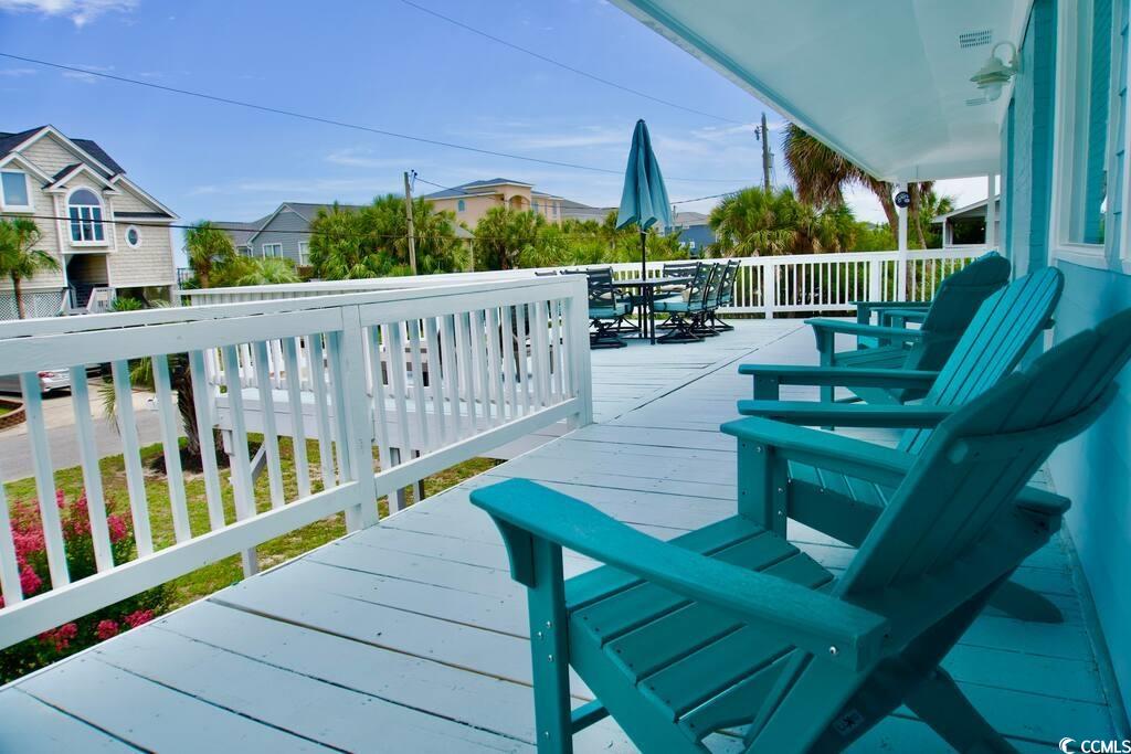 4702 South Ocean Boulevard Surfside Beach, SC 29575 - Photo 31 of 39 Wooden deck featuring outdoor dining space