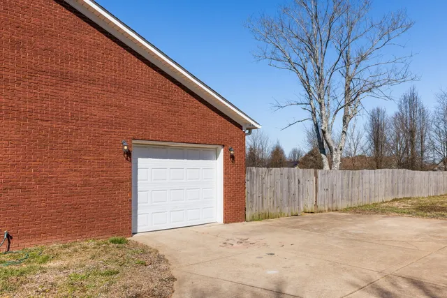 a view of outdoor space with swimming pool and trees in the background
