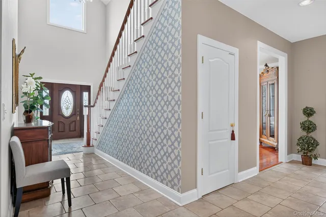 a view of a hallway with seating area