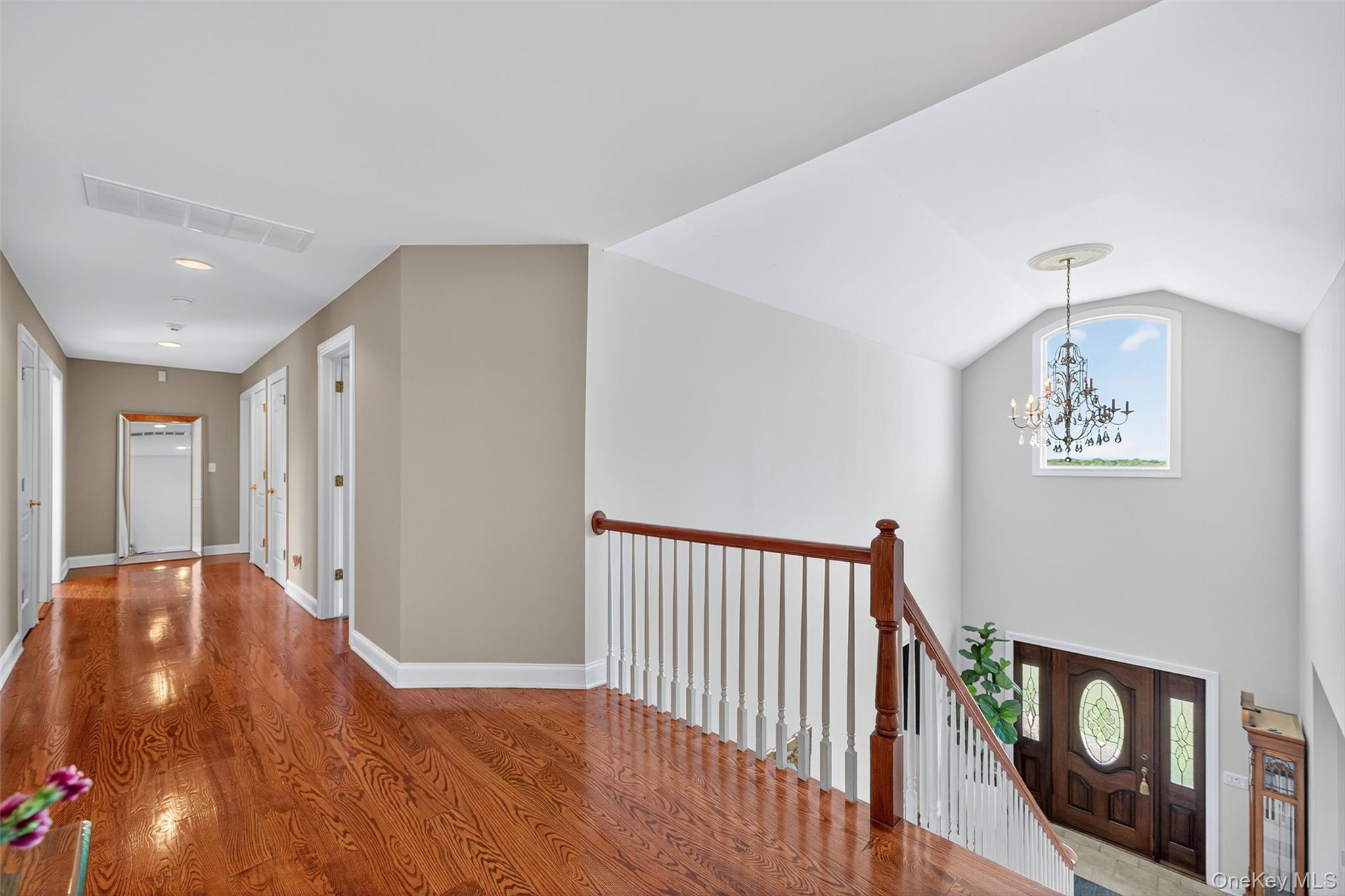 11 Dorian Way Campbell Hall, NY 10916 - Photo 22 of 40 a view of a hallway to a room with wooden floor and windows