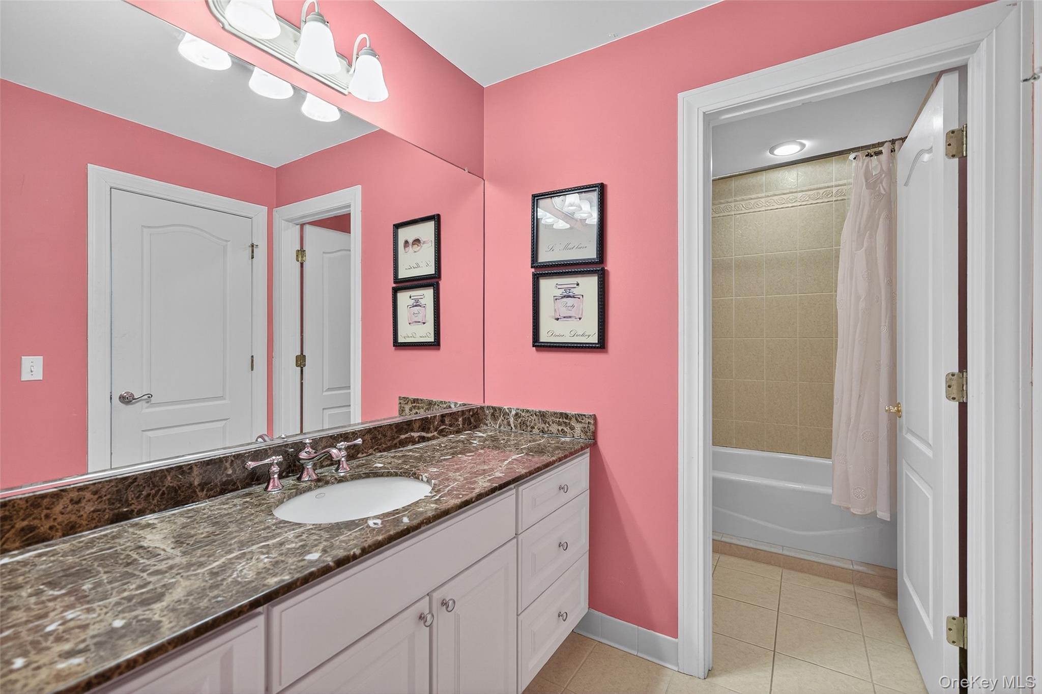 11 Dorian Way Campbell Hall, NY 10916 - Photo 27 of 40 a bathroom with a granite countertop sink a mirror and a shower