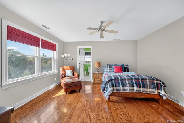 a bedroom with furniture and a window
