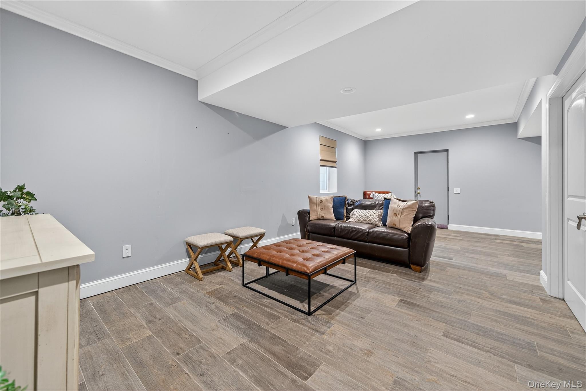 11 Dorian Way Campbell Hall, NY 10916 - Photo 34 of 40 a living room with furniture and a wooden floor
