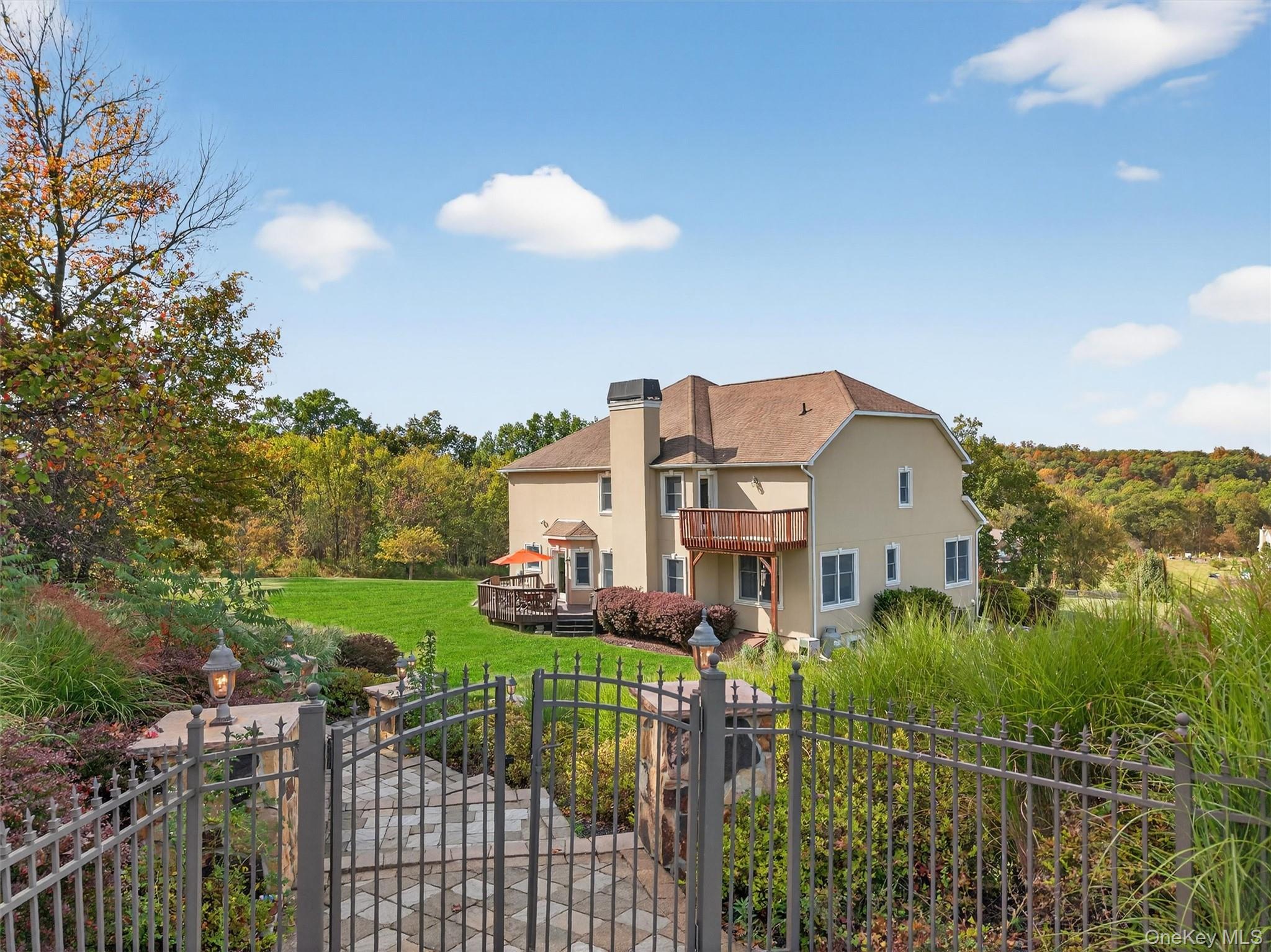 11 Dorian Way Campbell Hall, NY 10916 - Photo 39 of 40 a view of a house with a big yard and a garden