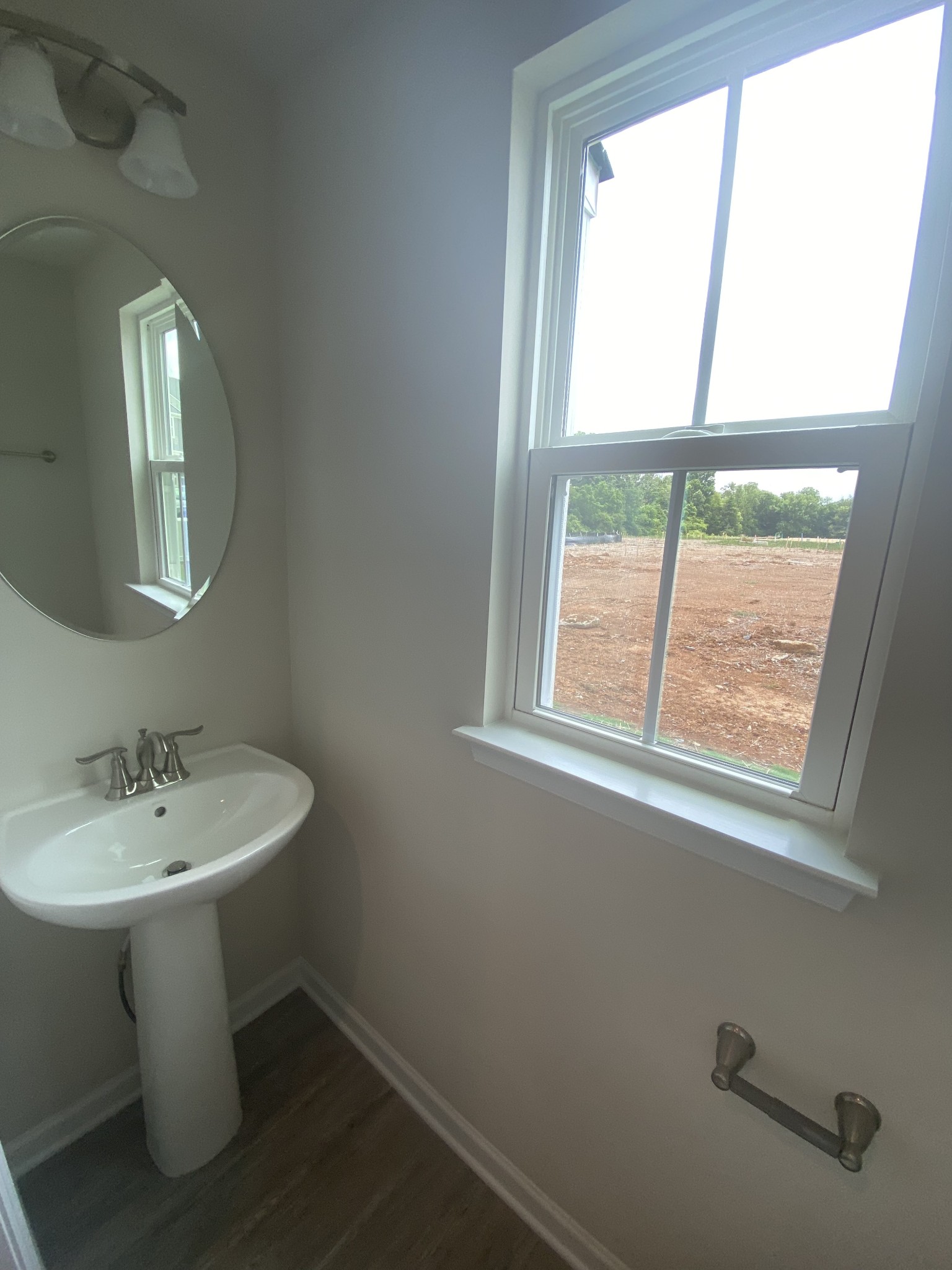107 Keelon Gap Road, Unit 180A Spring Hill, TN 37174 - Photo 15 of 16 a bathroom with a sink a toilet and a mirror
