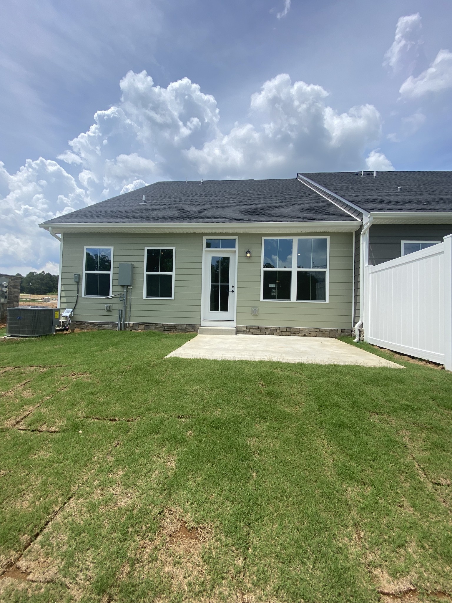 107 Keelon Gap Road, Unit 180A Spring Hill, TN 37174 - Photo 16 of 16 a view of a house with a backyard