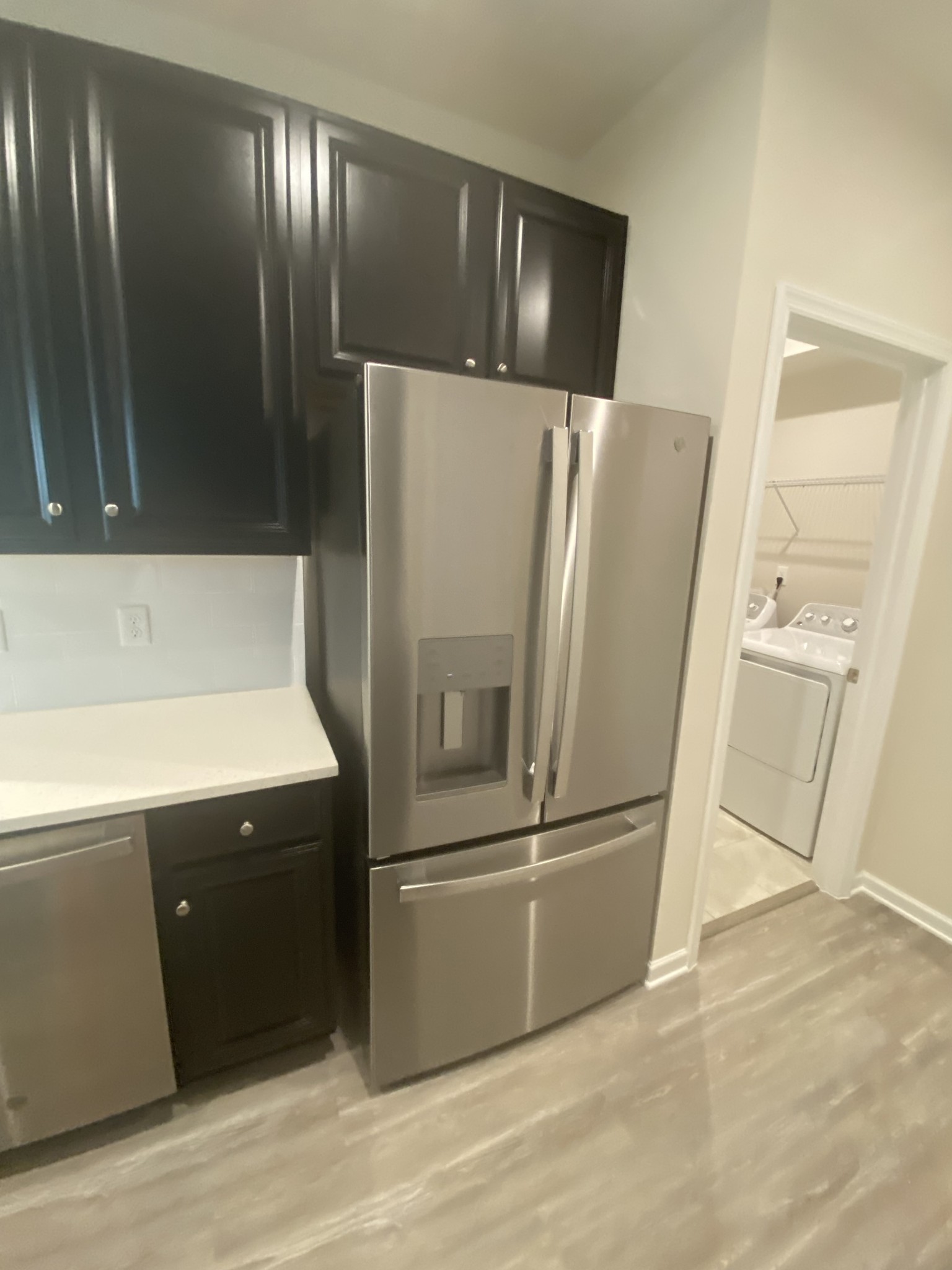 107 Keelon Gap Road, Unit 180A Spring Hill, TN 37174 - Photo 4 of 16 a metallic refrigerator freezer sitting in a kitchen