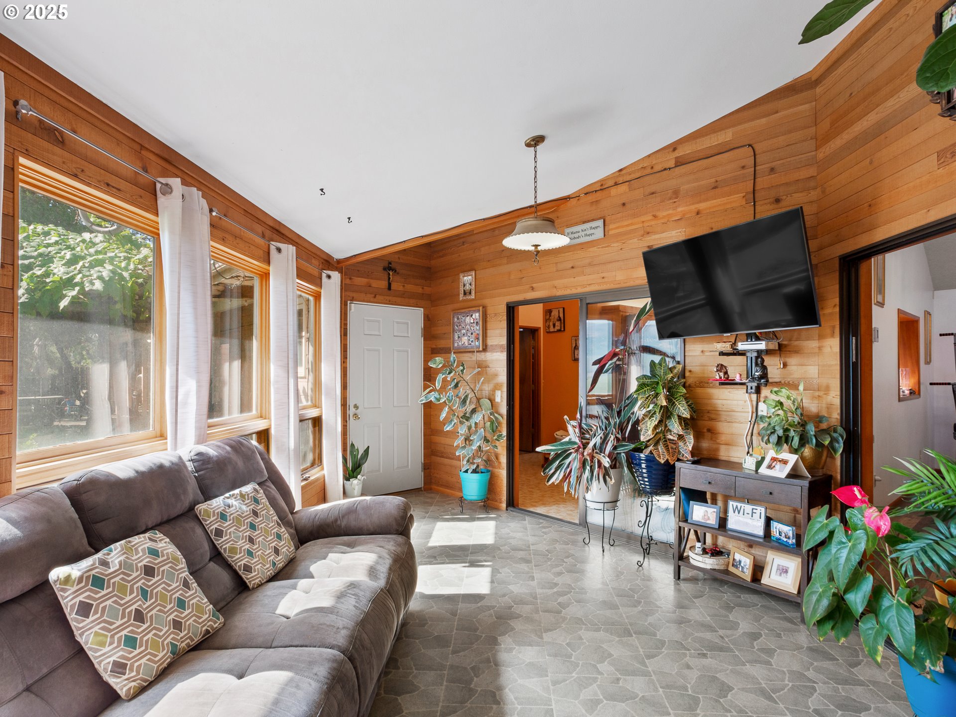 2018 Steele Road The Dalles, OR 97058 - Photo 14 of 36 a living room with furniture and a floor to ceiling window