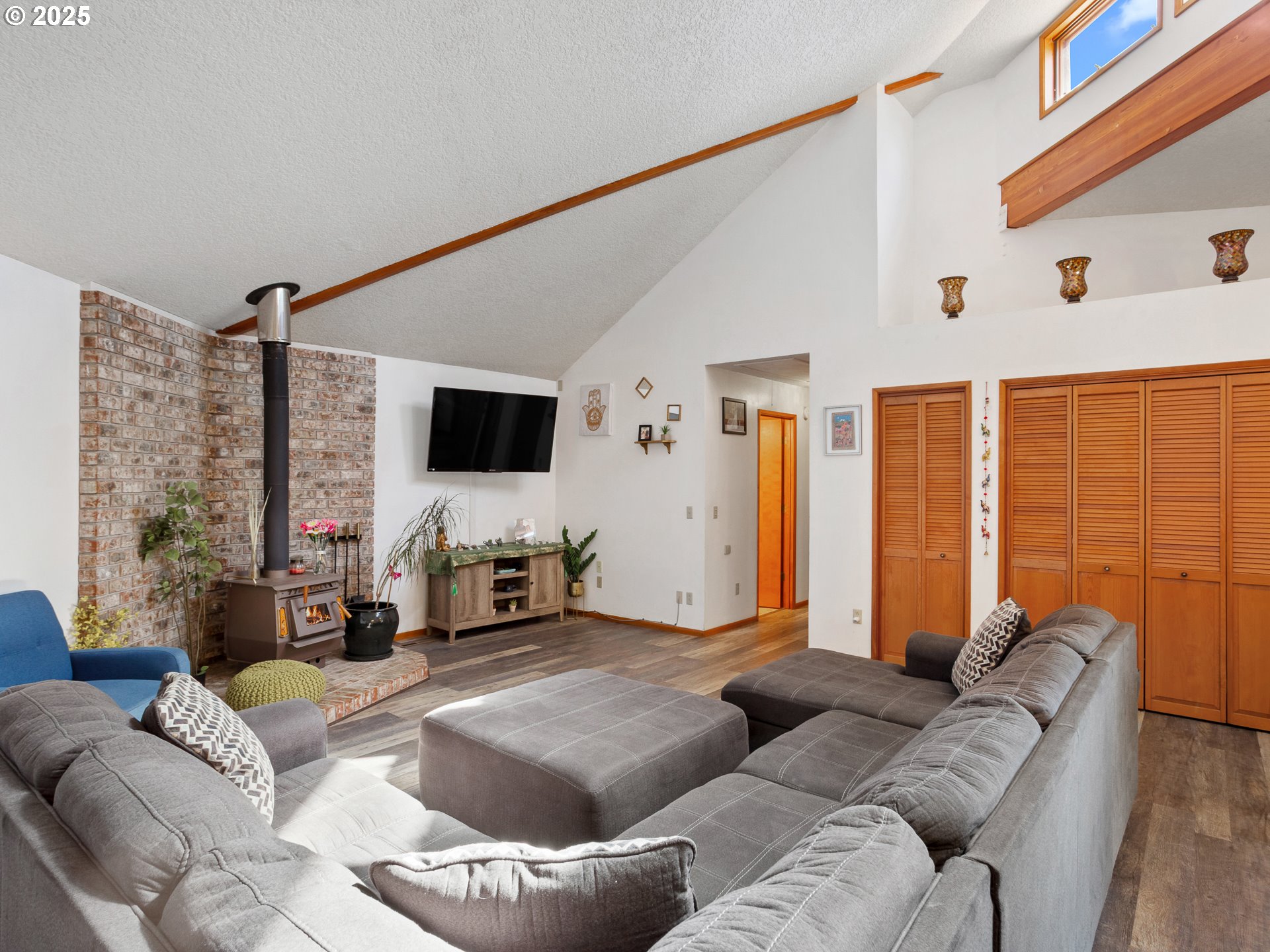 2018 Steele Road The Dalles, OR 97058 - Photo 21 of 36 a living room with furniture and a flat screen tv