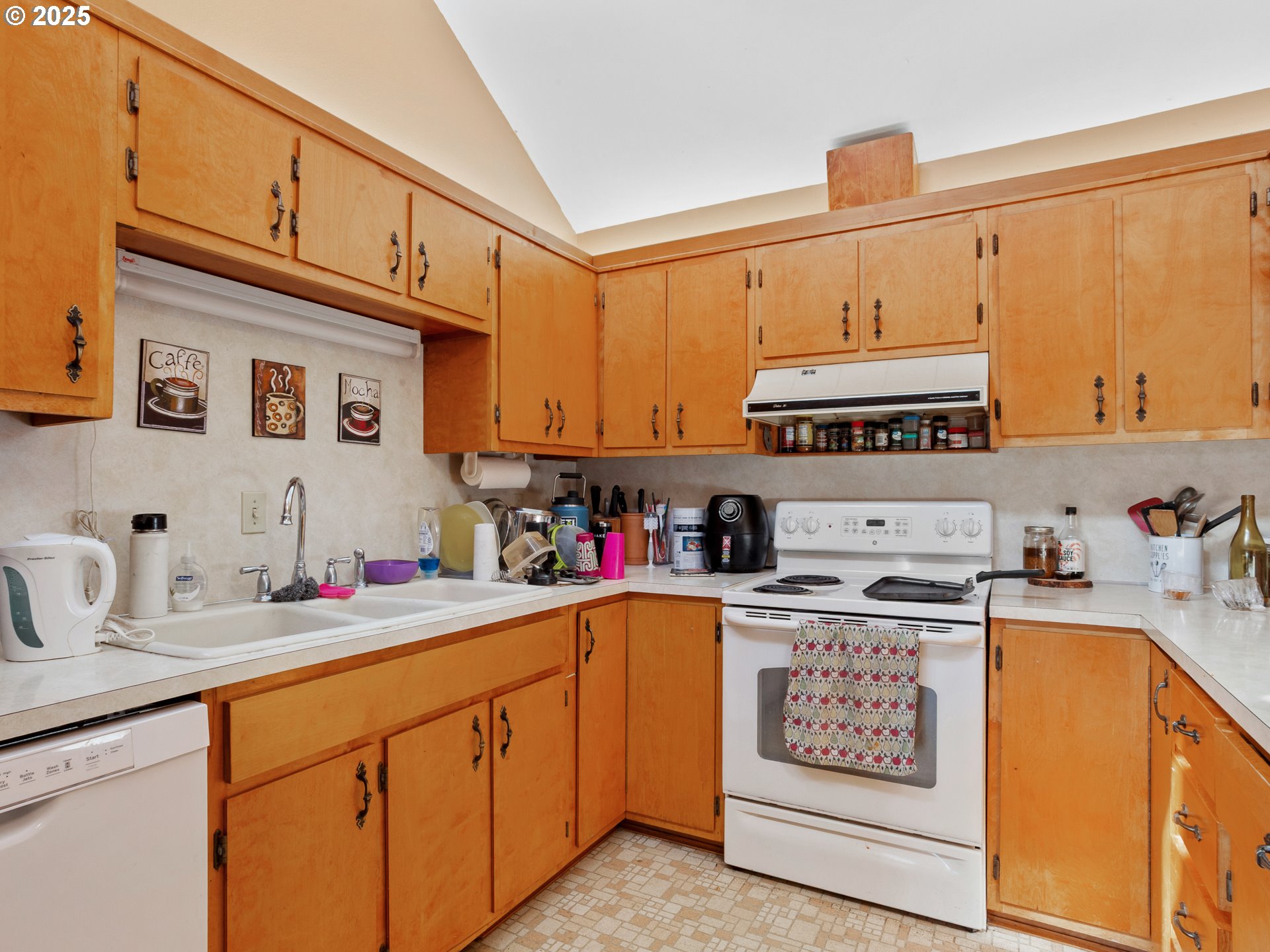 2018 Steele Road The Dalles, OR 97058 - Photo 24 of 36 a kitchen with stainless steel appliances granite countertop a sink stove and cabinets
