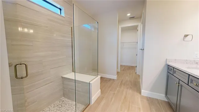a bathroom with a granite countertop sink mirror and double