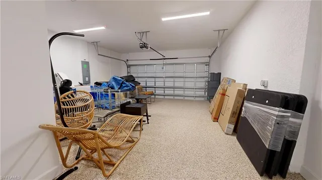 a kitchen with cabinets and a refrigerator