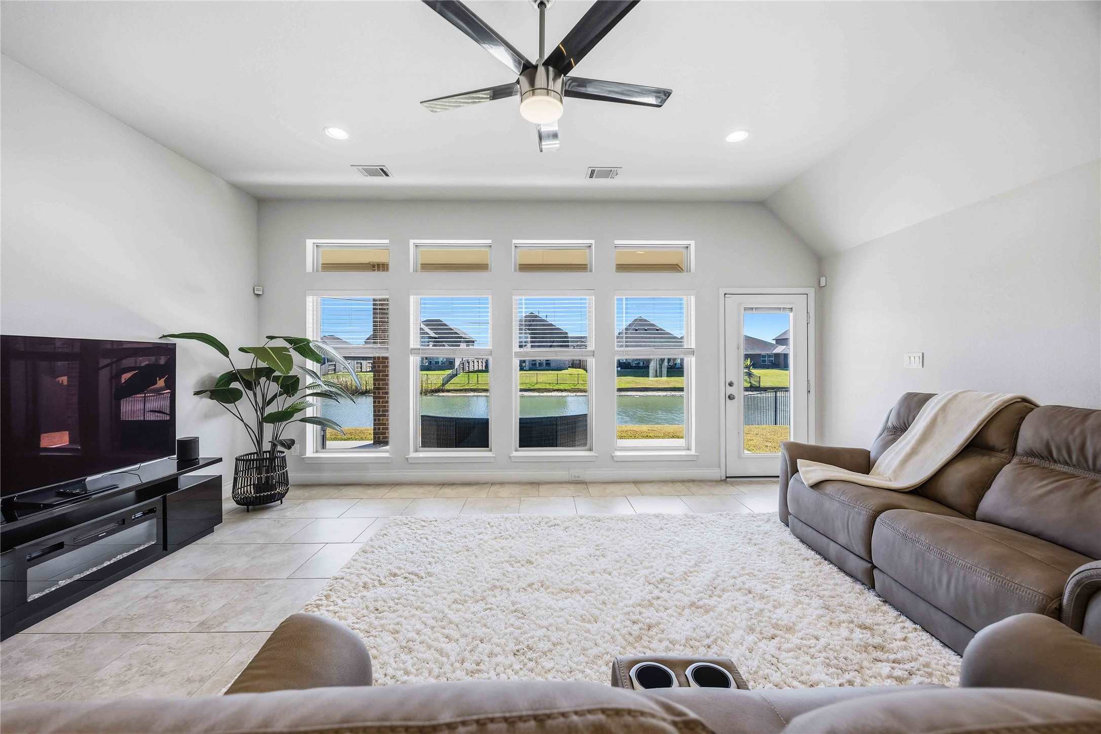 2726 Cutter Court Manvel, TX 77578 - Photo 13 of 44 a living room with furniture and a flat screen tv