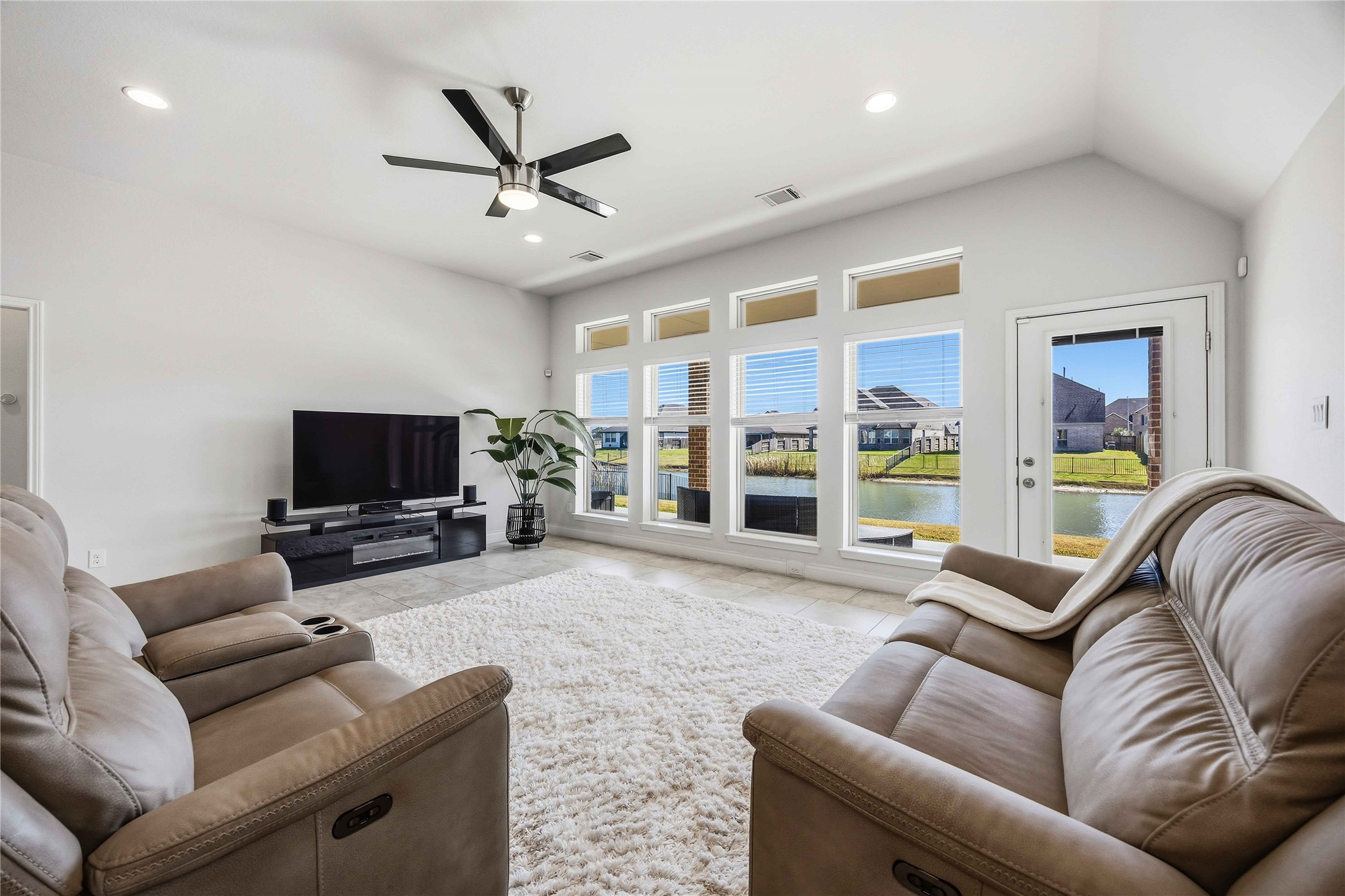 2726 Cutter Court Manvel, TX 77578 - Photo 14 of 44 a living room with furniture and a flat screen tv