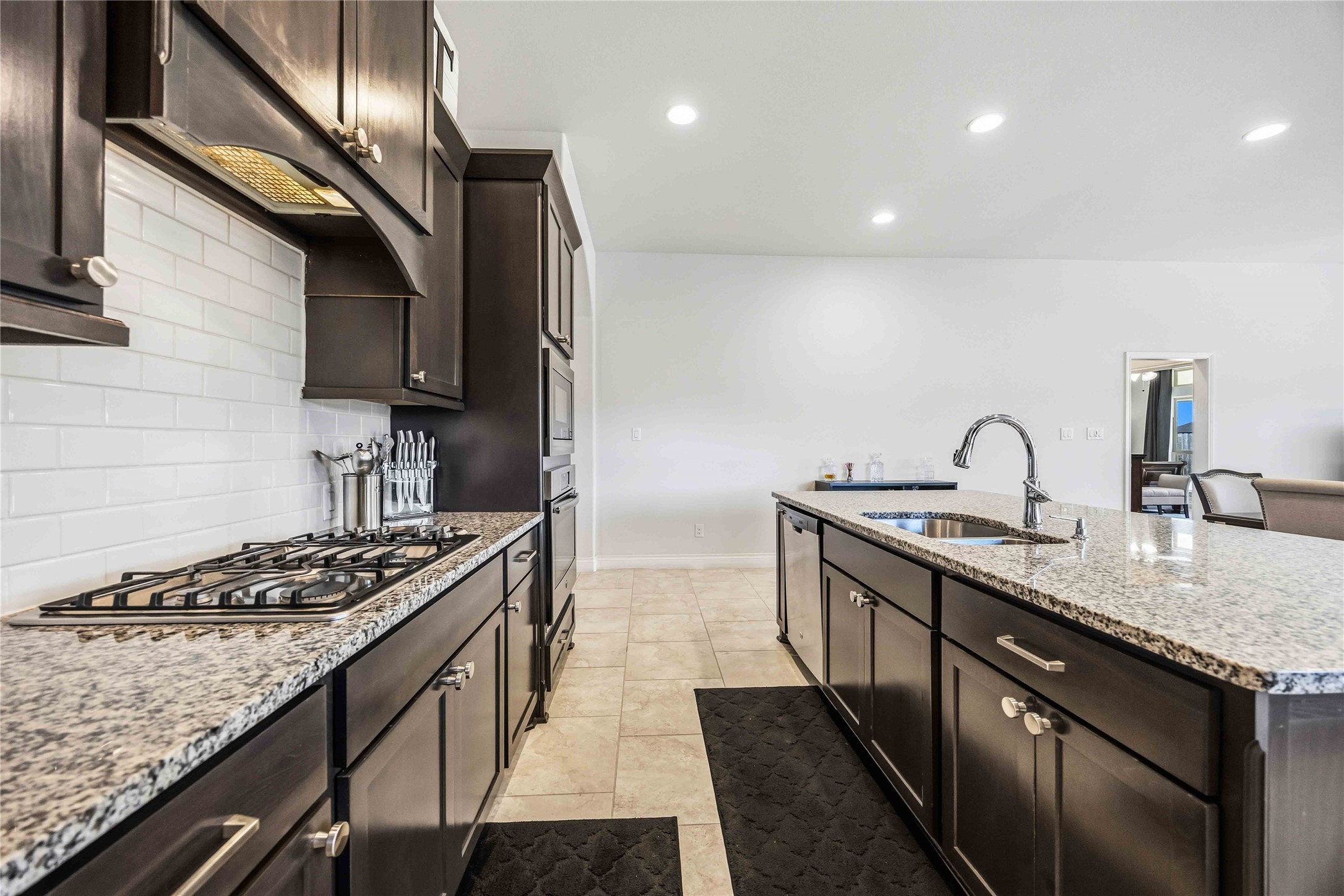 2726 Cutter Court Manvel, TX 77578 - Photo 22 of 44 a kitchen with stainless steel appliances granite countertop a sink stove and cabinets
