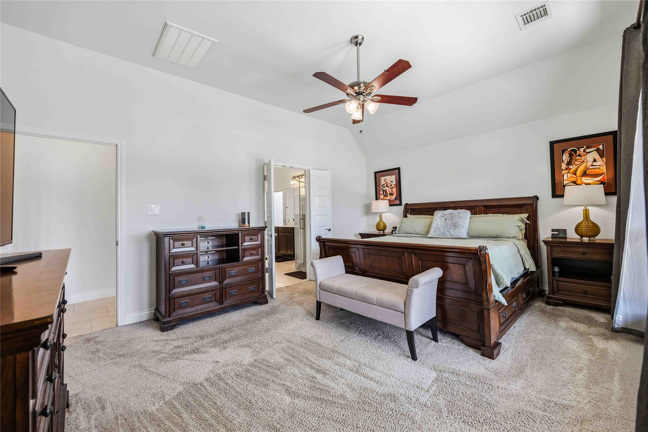 2726 Cutter Court Manvel, TX 77578 - Photo 25 of 44 a bedroom with a bed and a chandelier