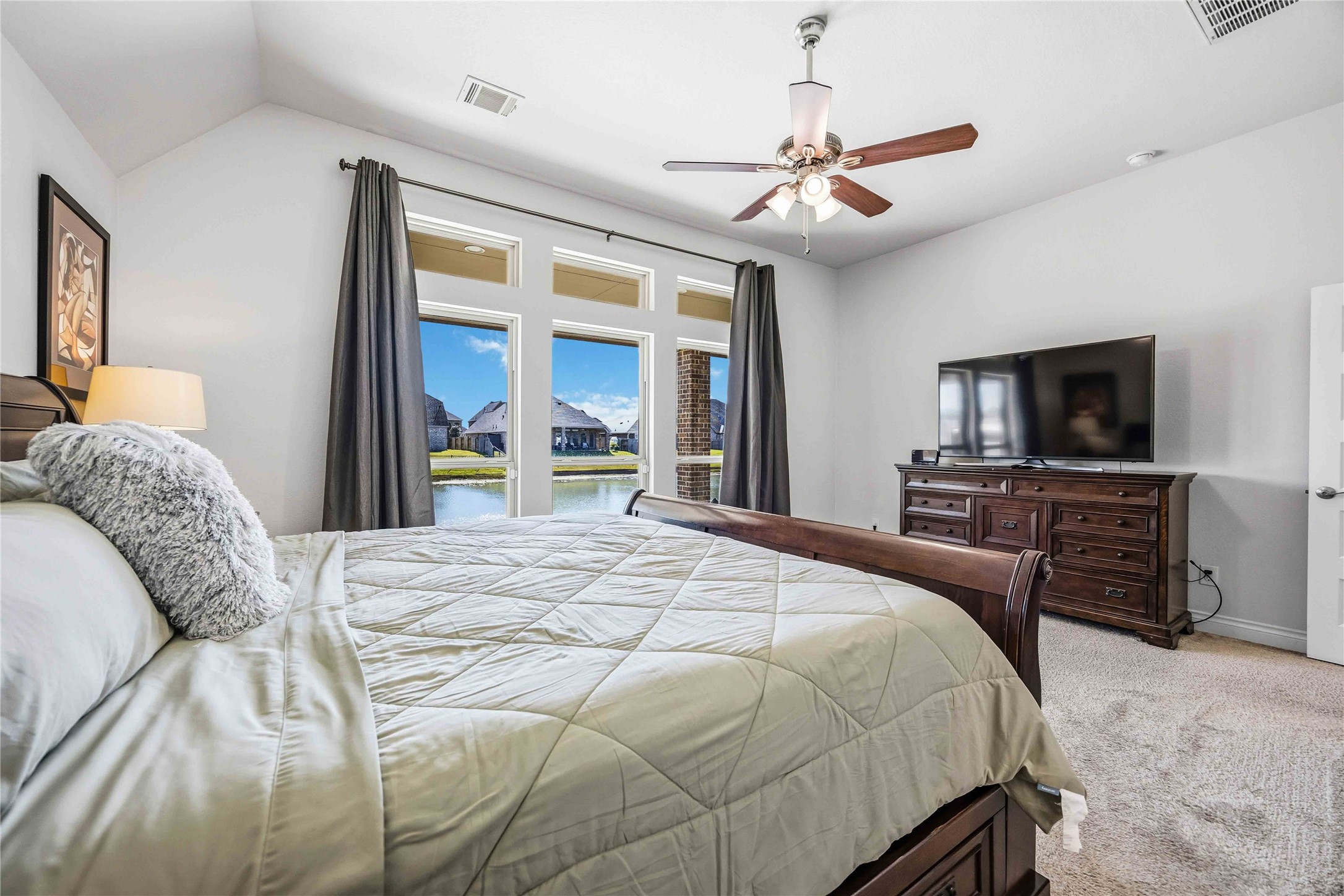 2726 Cutter Court Manvel, TX 77578 - Photo 26 of 44 a bedroom with a bed and a flat screen tv