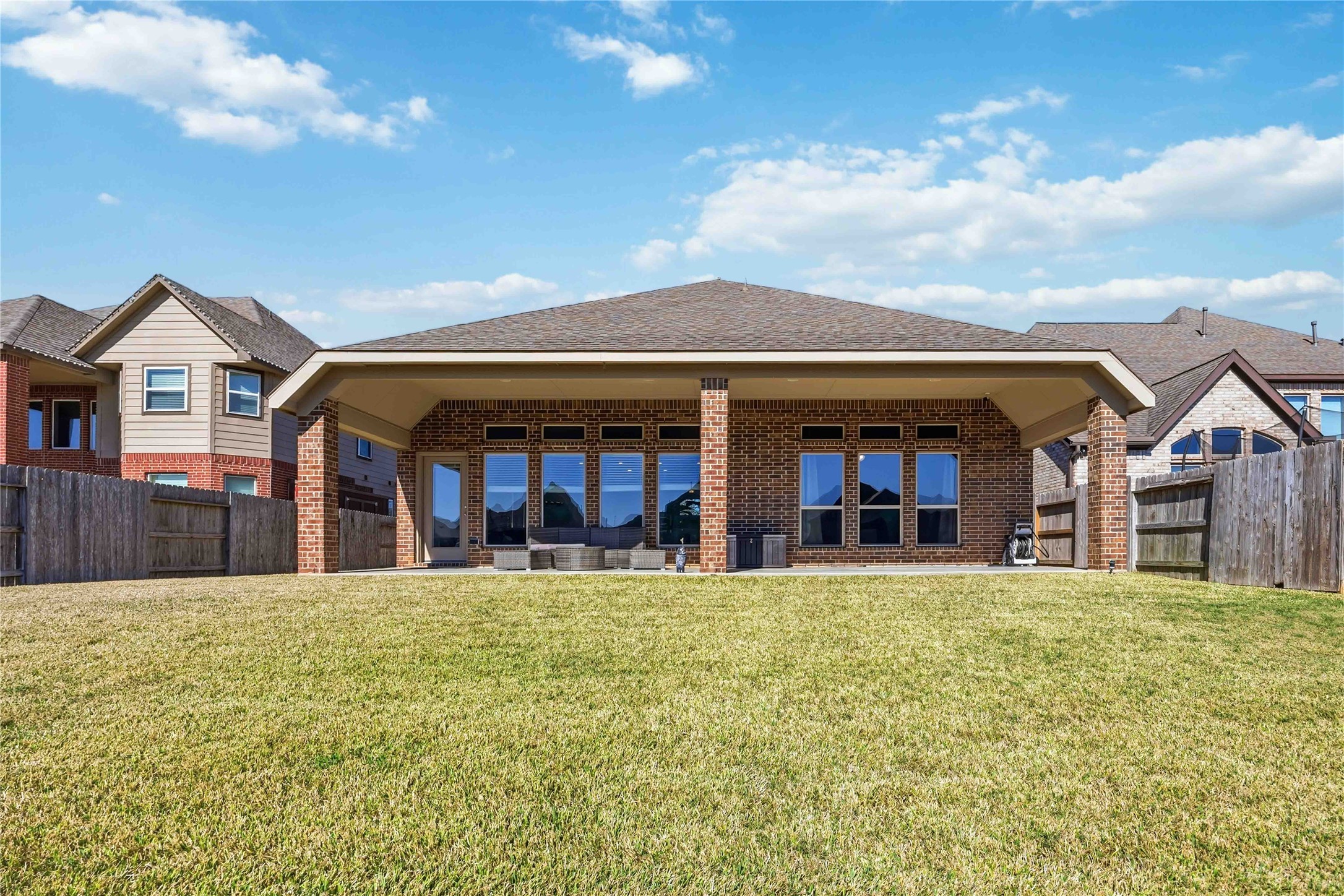 2726 Cutter Court Manvel, TX 77578 - Photo 44 of 44 a view of a white house with large trees and a big yard