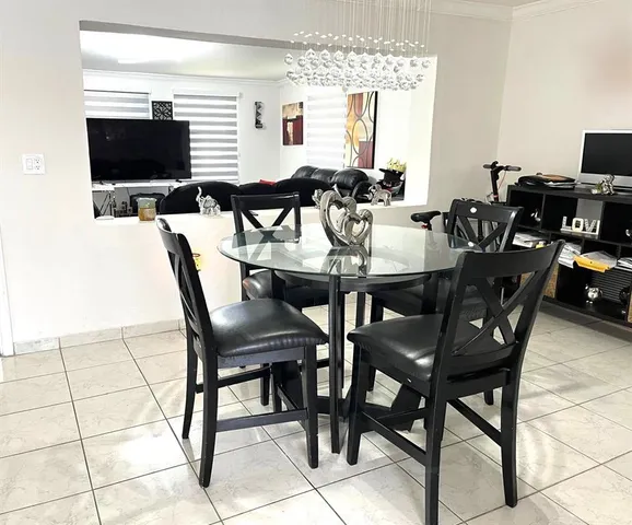 a view of a dining room with furniture