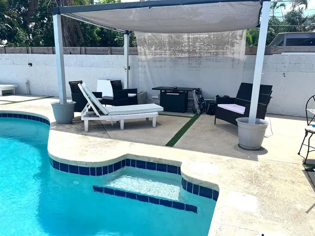 a terrace of a house with outdoor seating