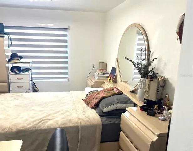 a kitchen with a refrigerator and cabinets