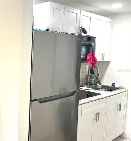 a workspace with furniture and window