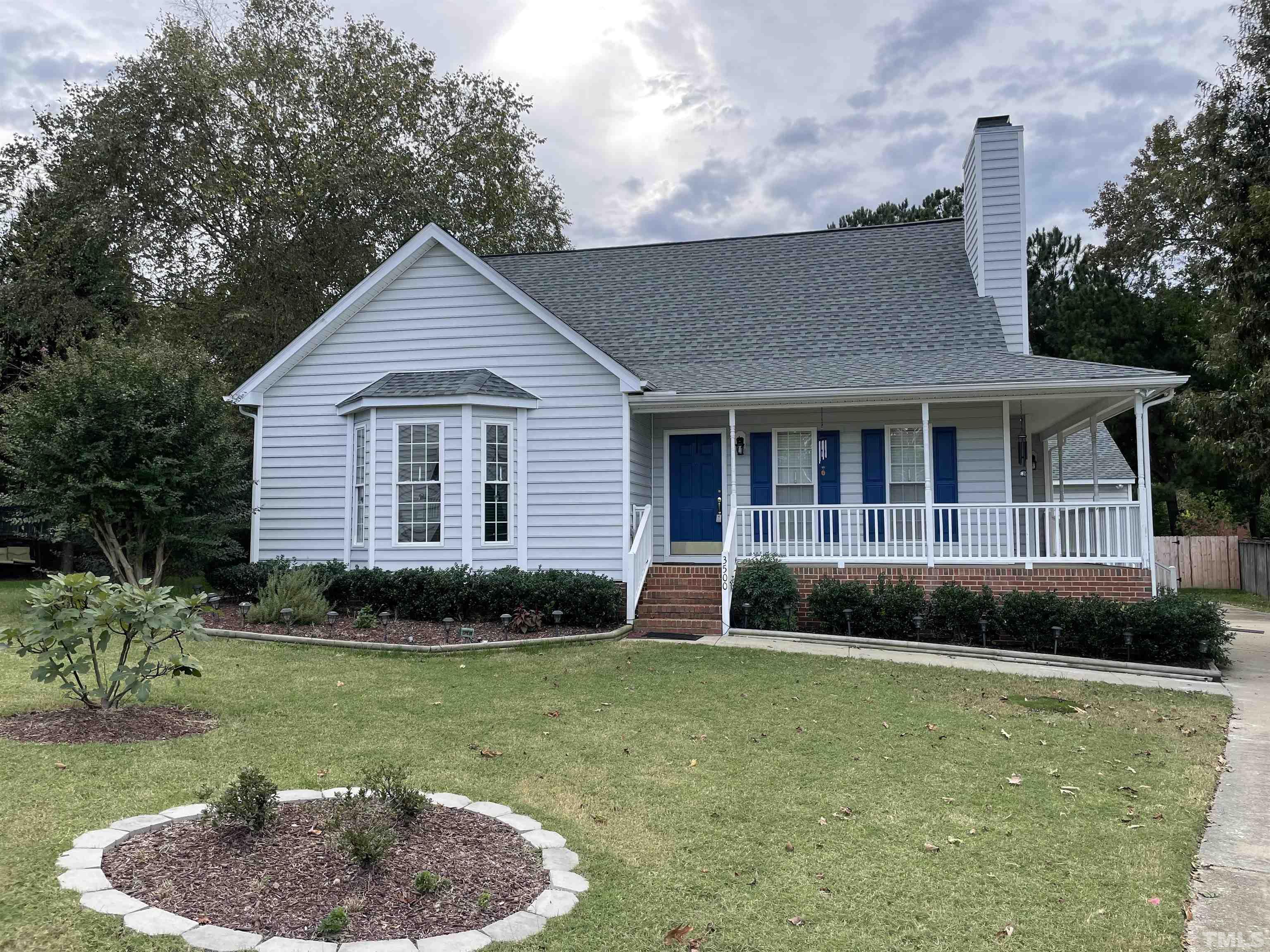 3500 Milky Way Raleigh, NC 27604 - Photo 1 of 30 a front view of a house with a yard and garage