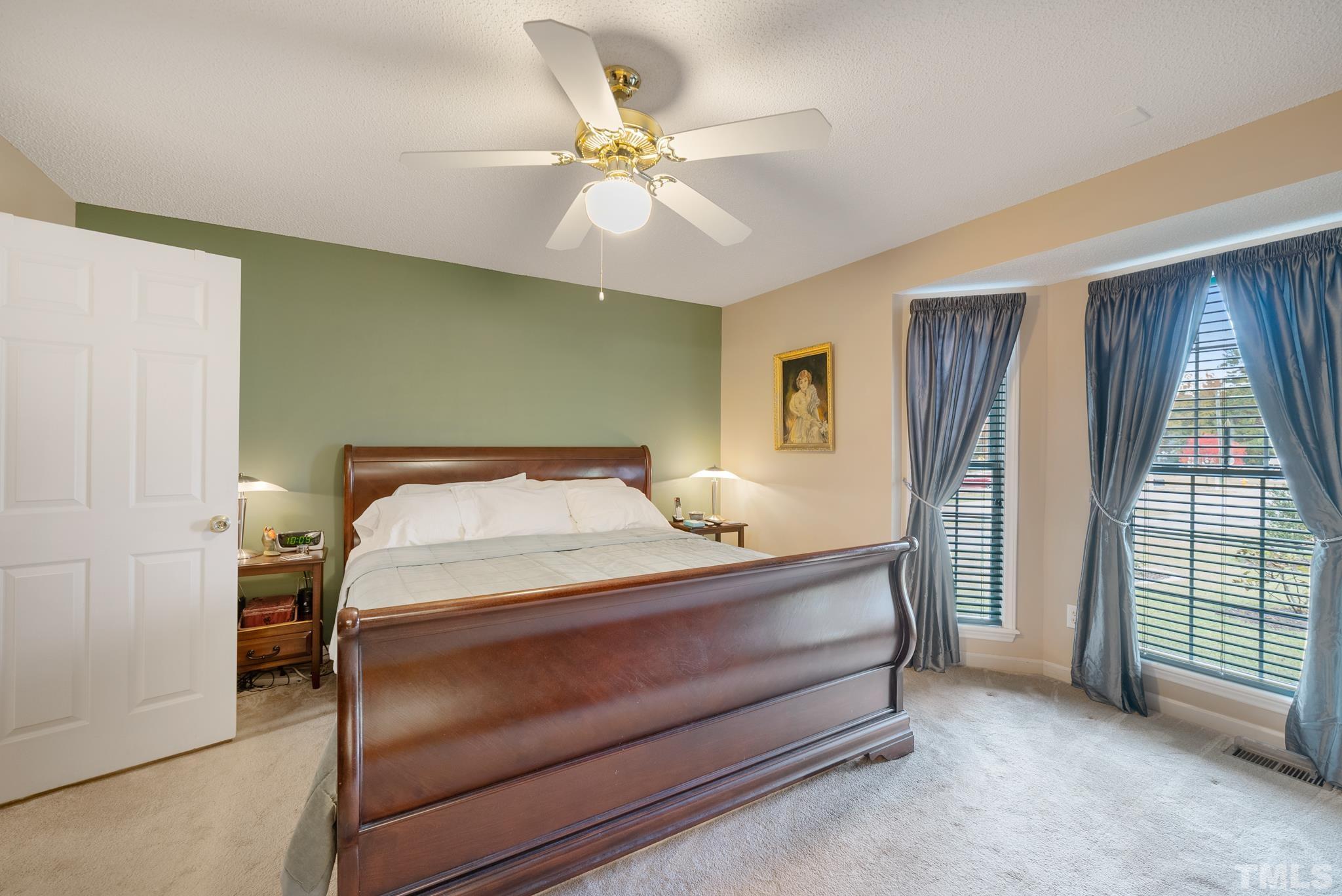 3500 Milky Way Raleigh, NC 27604 - Photo 11 of 30 a bedroom with a bed and a chandelier