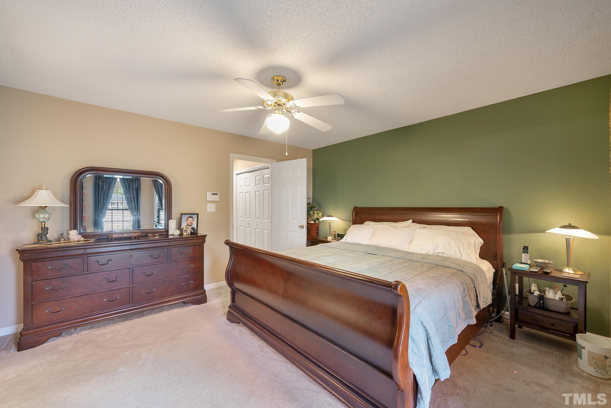 3500 Milky Way Raleigh, NC 27604 - Photo 12 of 30 a bedroom with a bed and a chandelier
